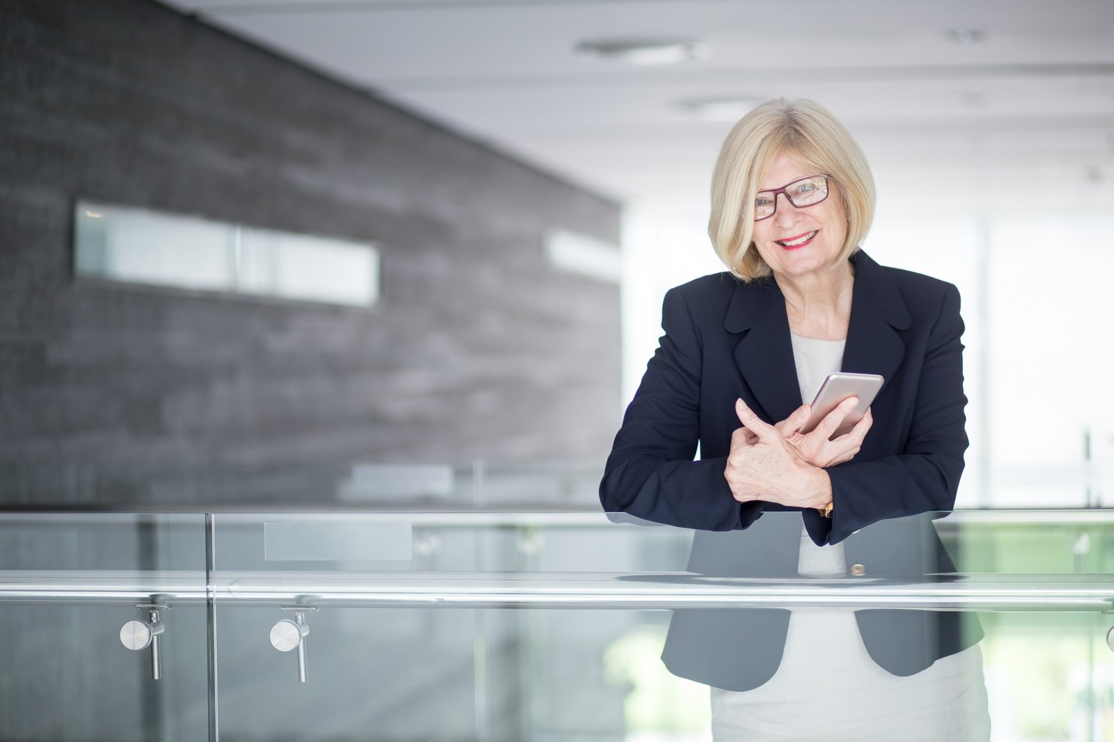 http://img.b2bpic.net/free-photo/positive-senior-businesswoman-holding-cellphone_1262-5400.jpg